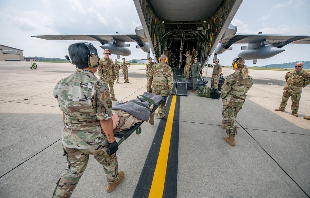 Members of the 130th Airlift Wing perform aeromedical evacuation drills as part of the week-long joint training exercise Sentry Storm at McLaughlin Air National Guard Base in Charleston, West Virginia, July 21, 2021. (Edwin L. Wriston/Army National Guard)