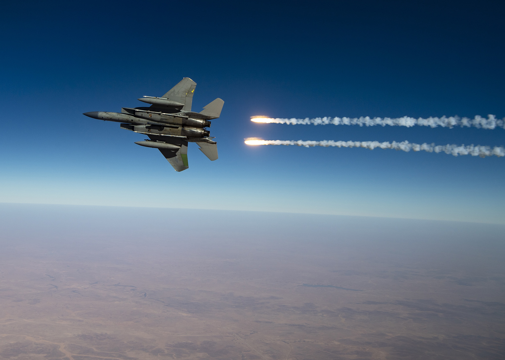 A U.S. Air Force F-15C Eagles release flares over the U.S. Central Command area of responsibility Aug. 13, 2020